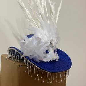 Mardi Gras hats

“Cinda Rella”.   Elegant Blue and White Feathered Hat